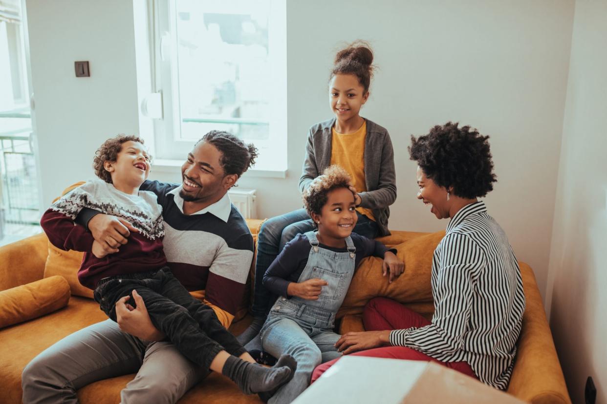 An image of a family in their living room.