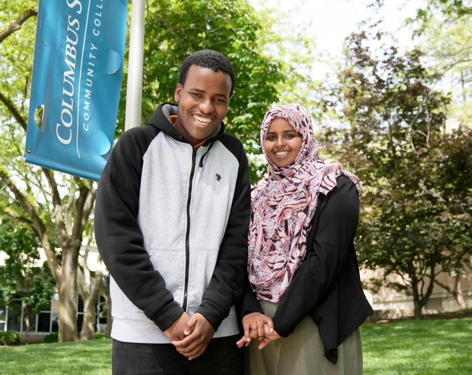 Nafisa Jamale, a community-based clinical supervisor at the Buckeye Ranch, and Columbus State Community College student Jibril Ahmed pose for a photo on campus. Jamale helped Ahmed get the support he needed to enroll and complete his studies at Columbus State, and he will start classes at Ohio State University in the fall.