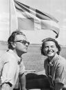 <p>Ingrid Bergman and her husband, Lars Schmidt, sit in front of the Swedish flag flying off the back of their sailboat, the Mayflower. The Swedish film star sports wind-blown hair and smiles for the camera in a cotton button-down. </p>