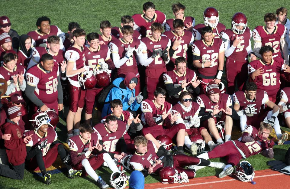 O'Neill players celebrate their 38-6 victory over Westlake in the state Class C regional final at Middletown High School Nov. 19, 2022. 