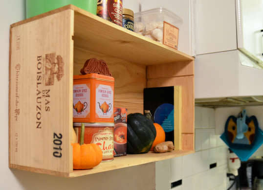 <p>This durable wine crate shelf takes an elevated approach to countertop clutter. To achieve a similar look, thoroughly clean a <a href="http://www.bobvila.com/slideshow/8-new-ways-to-use-old-wooden-crates-47760" rel="nofollow noopener" target="_blank" data-ylk="slk:wooden crate;elm:context_link;itc:0;sec:content-canvas" class="link ">wooden crate</a>, stain it as desired, and mount the bottom of the crate on the wall, over a microwave, or under a cabinet to serve up stylish storage. <i>Photo: <a href="http://www.starsforstreetlights.com/2012/10/diy-wine-crate-kitchen-shelf.html" rel="nofollow noopener" target="_blank" data-ylk="slk:starsforstreetlights.com;elm:context_link;itc:0;sec:content-canvas" class="link ">starsforstreetlights.com</a><br></i><b>RELATED: <a href="http://www.bobvila.com/slideshow/9-ideas-to-steal-from-real-people-s-kitchens-48898" rel="nofollow noopener" target="_blank" data-ylk="slk:9 Ideas to Steal from Real People’s Kitchens;elm:context_link;itc:0;sec:content-canvas" class="link ">9 Ideas to Steal from Real People’s Kitchens</a></b></p>