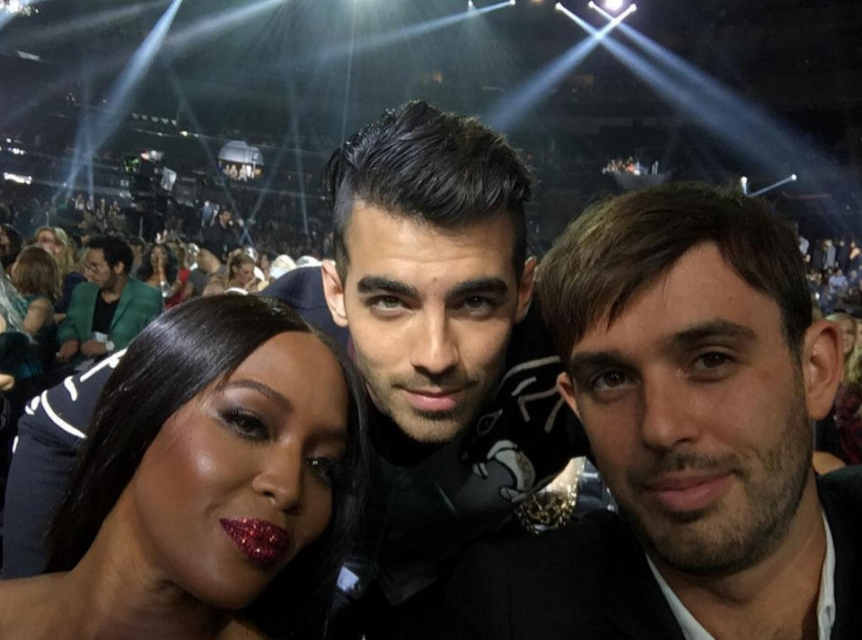 He also posed for a pic with supermodel Naomi Campbell, who was supporting her pal Rihanna.