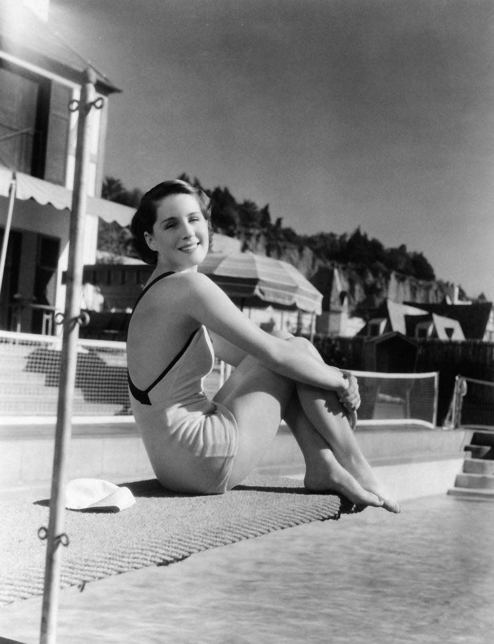 By the swimming pool of her Hollywood home&nbsp;sometime in 1930.