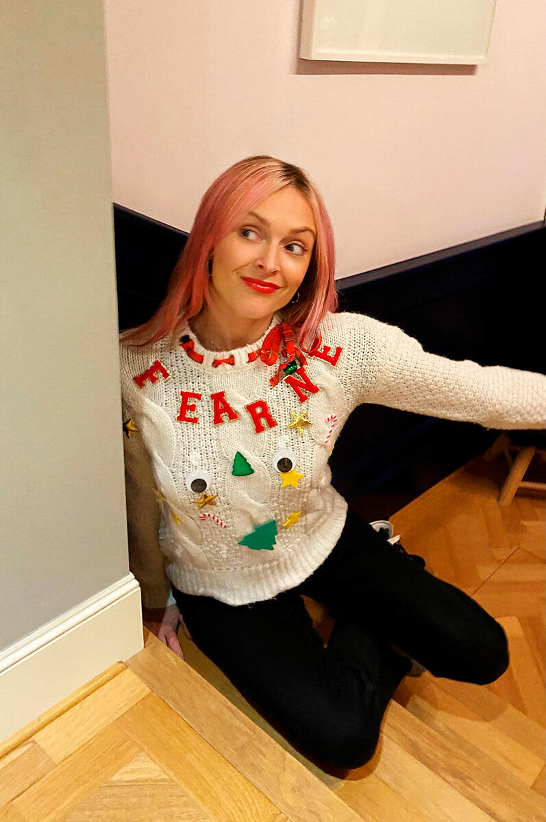 Fearne Cotton shows off her jumper (Save The Children/PA)