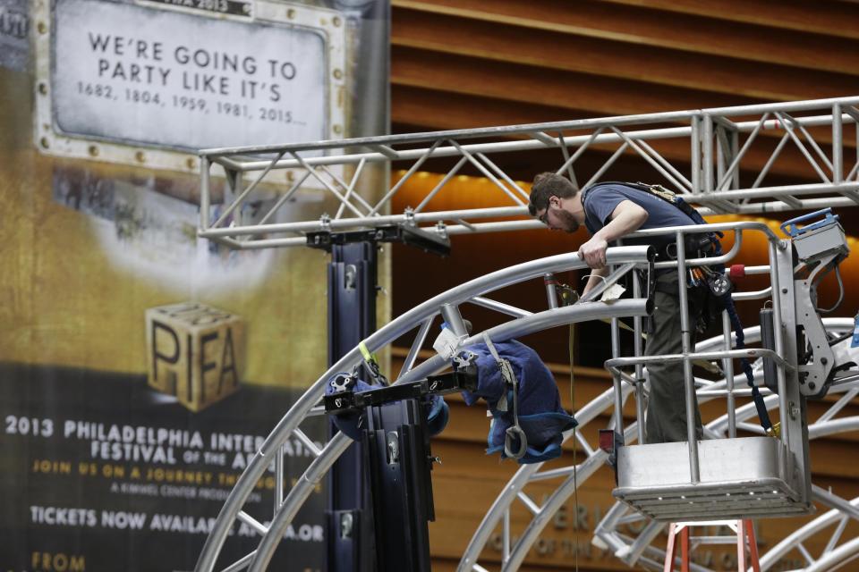 A workmen begin Preparations for the Philadelphia International Festival of the Arts 2013, at the Kimmel Center Tuesday, Feb. 19, 2013, in Philadelphia. The citywide festival is scheduled to run from March 28 to April 27. (AP Photo/Matt Rourke)