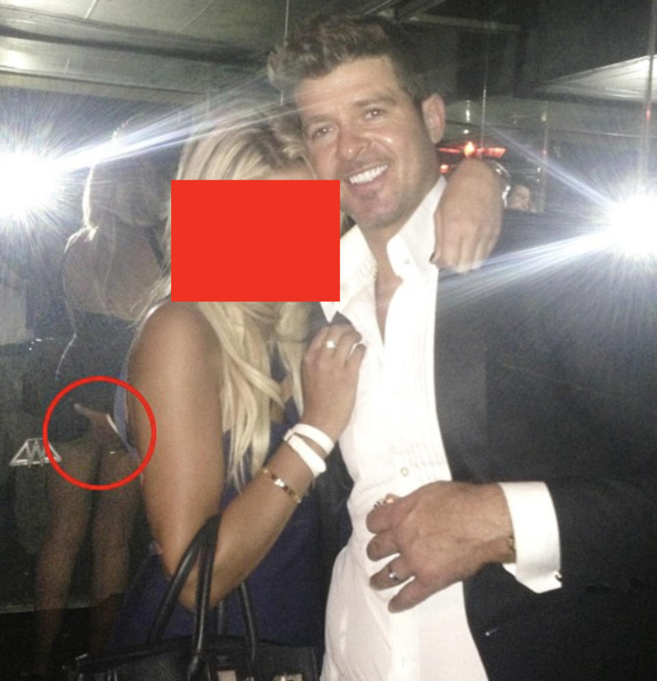 Robin Thicke with his hand on a fan's backside