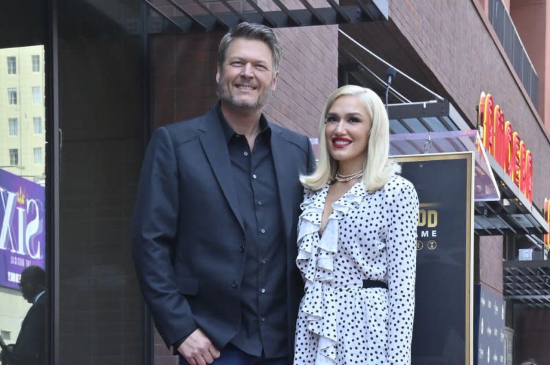 Gwen Stefani (R) and Blake Shelton attend Shelton's Hollywood Walk of Fame ceremony in May. File Photo by Jim Ruymen/UPI