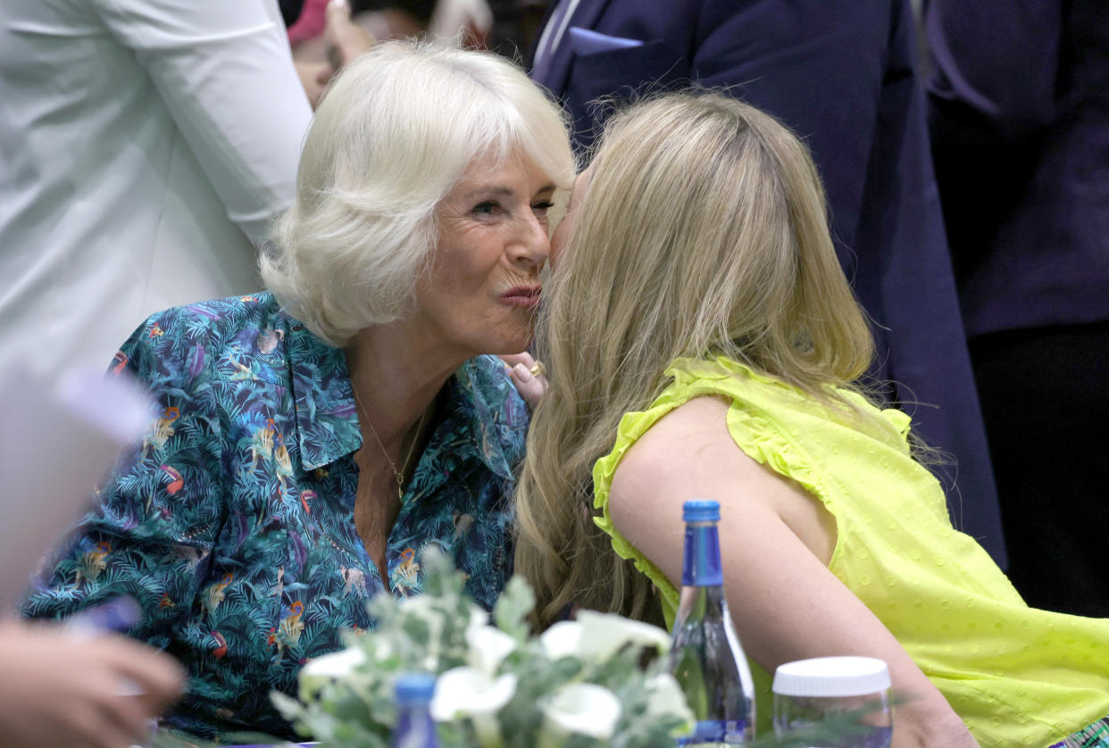 The Duchess of Cornwall kisses Carrie Johnson, wife of Prime Minister Boris Johnson as they attend a Violence Against Women and Girls event at the Kigali Convention Centre at a Violence Against Women and Girls event showcasing the work of the Commonwealth Secretariat's partnership with the NO MORE Foundation, at the Kigali Convention Centre, as part of the royal visit to Rwanda. Picture date: Thursday June 23, 2022.
