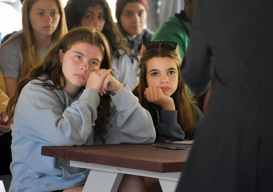 Ryann Mackinley and Mia Zachos, from Easton Middle School, listen to Pam Garramone speak at the Teen Safety Summit at Camp Welch that was held in May.