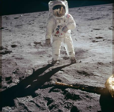 Astronaut Edwin E. Aldrin Jr., lunar module pilot, walks on the surface of the moon near the leg of the Lunar Module (LM) "Eagle" during the Apollo 11 extravehicular activity (EVA) in this July 20, 1969 NASA handout photo. The photograph is one of more than 12,000 from NASA's archives recently aggregated on the Project Apollo Archive Flickr account. REUTERS/NASA/Handout via Reuters