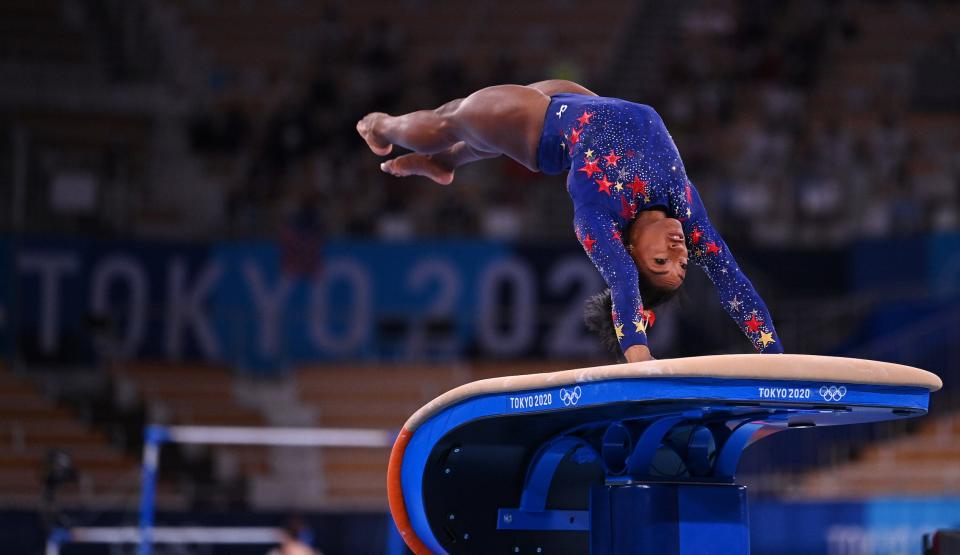 Simone Biles competes on the vault.