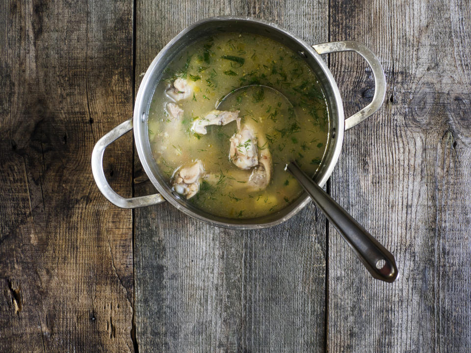 Chicken soup in a sauce pan.