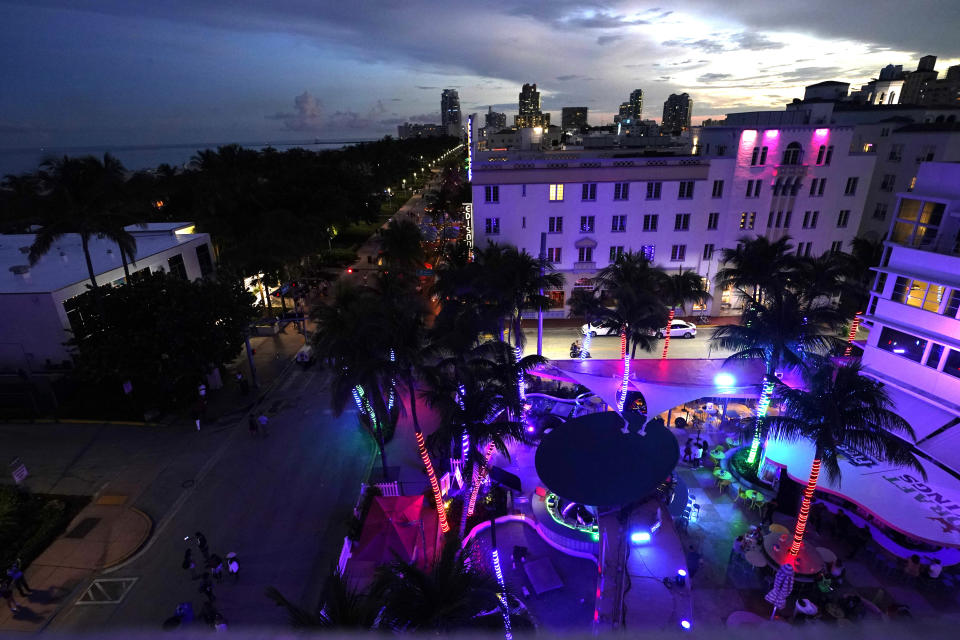 The Clevelander Hotel and Bar is shown at dusk along Ocean Drive, Friday, Sept. 24, 2021, in Miami Beach, Fla. For decades, this 10-block area has been one of the most glamorized spots in the world, made cool by TV shows like Miami Vice, where the sexiest models gathered at Gianni Versace's ocean front estate and rappers wrote lines about South Beach's iconic Ocean Drive. (AP Photo/Lynne Sladky)