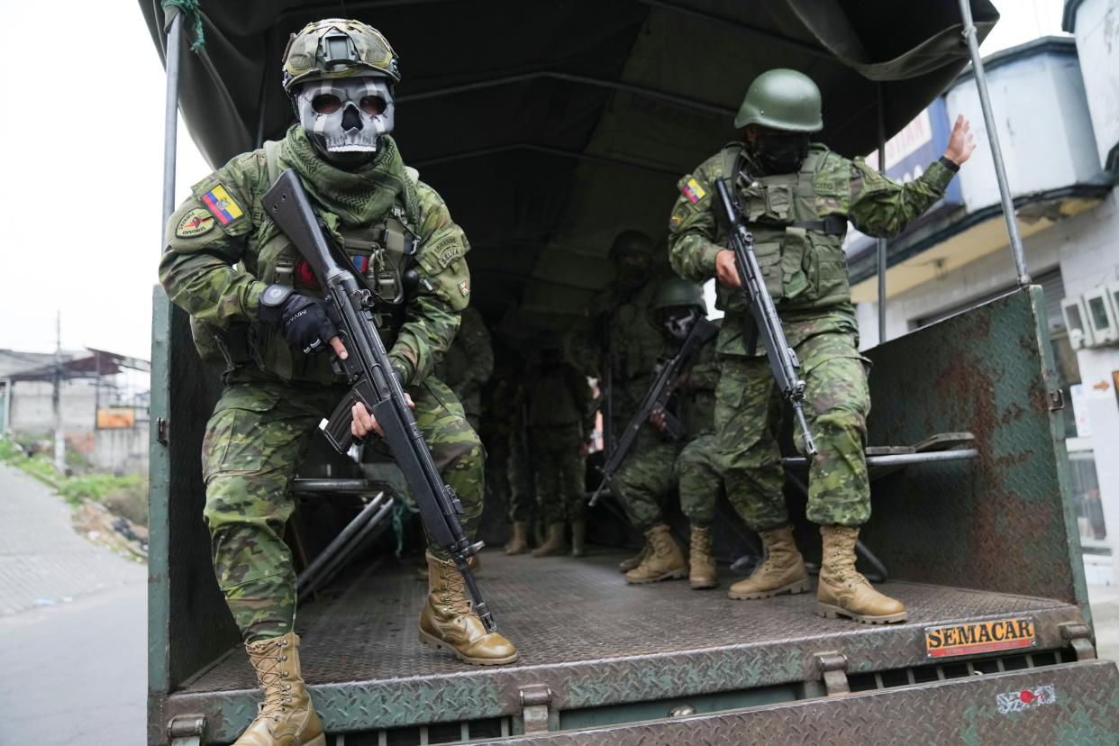 Soldiers patrol a residential area on the south side of Quito, Ecuador, on Jan. 12, 2024, in the wake of the apparent escape of a powerful gang leader from prison. President Daniel Noboa decreed a national state of emergency, a measure that lets authorities suspend people’s rights and mobilize the military in places like the prisons. The government also imposed a curfew from 11 p.m. to 5 a.m.