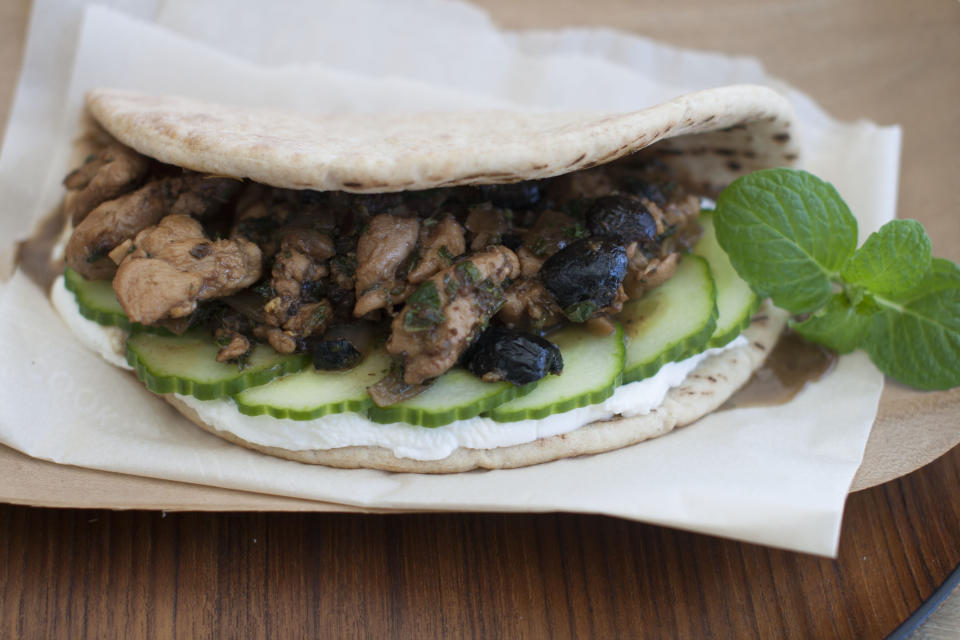 This March 24, 2014 photo shows minted lemon and olive chicken wraps in Concord, N.H. (AP Photo/Matthew Mead)