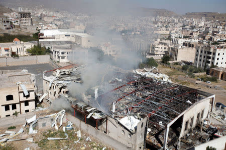 Smoke rises from the community hall where Saudi-led warplanes struck a funeral in Sanaa, October 9, 2016. REUTERS/Khaled Abdullah