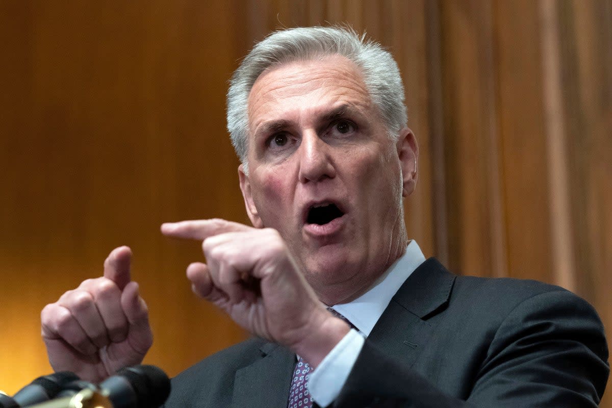 House Speaker Kevin McCarthy aggressively defended the former president on Friday (Associated Press)