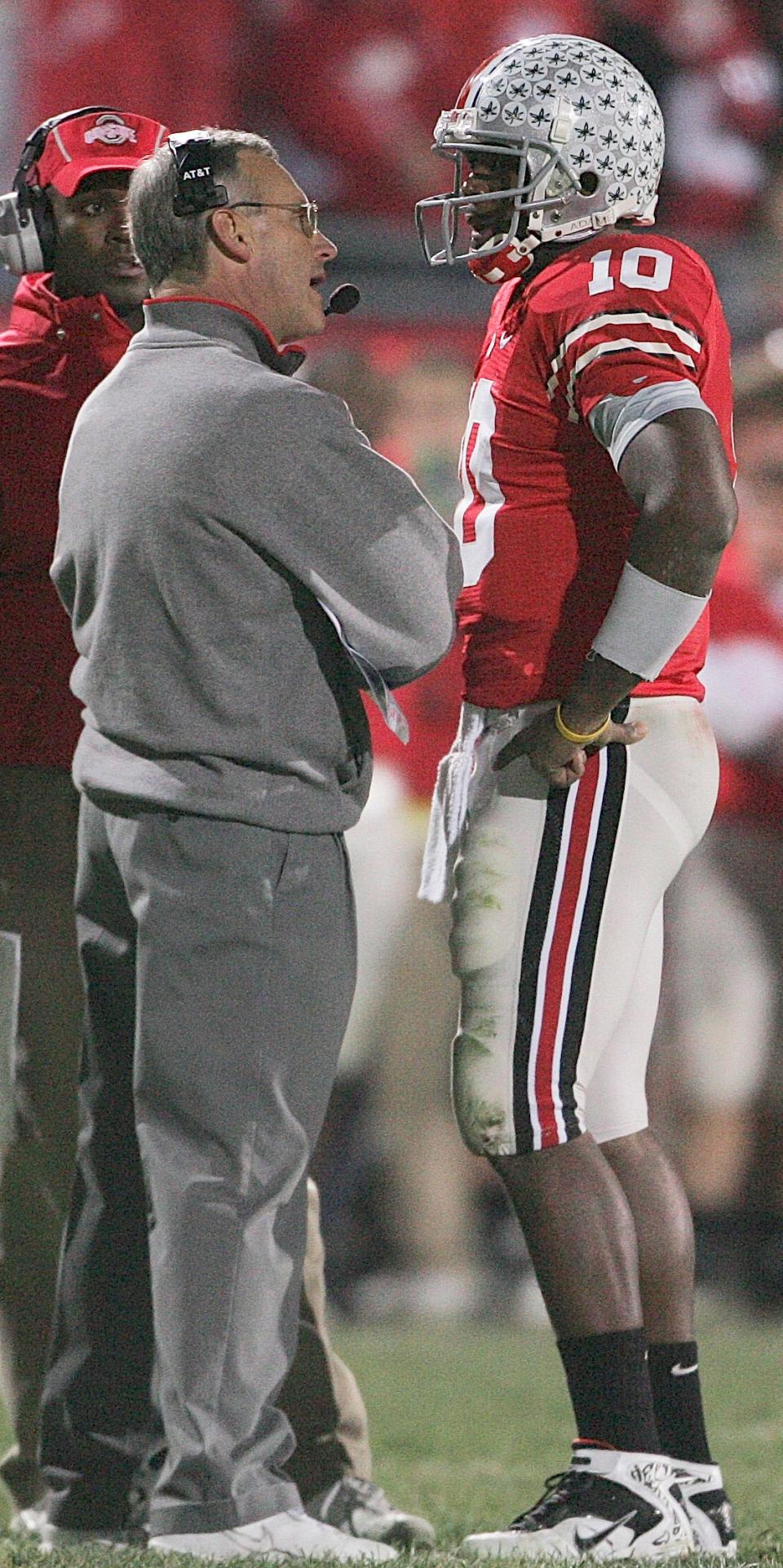 Ohio State's head football coach Jim Tressel with quarterback Troy Smith, 10, in the second half of their game against Michigan at the Ohio Stadium, November 18, 2006. (Dispatch photo by Neal C. Lauron)