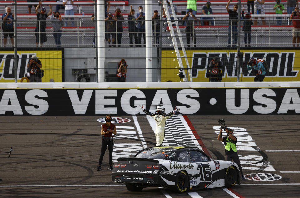 AJ Allmendinger, center, celebrates after winning a NASCAR Xfinity Series auto race at Las Vegas Motor Speedway, Saturday, March 6, 2021. (Chase Stevens/Las Vegas Review-Journal via AP)