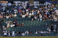 Fans watch during the first inning of a baseball game between the Baltimore Orioles and the Chicago White Sox in Chicago, Friday, June 24, 2022. (AP Photo/Nam Y. Huh)