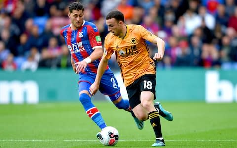 Joel Ward and Diogo Jota battle for the ball  - Credit: PA