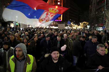 Demonstrators walk along a street during an anti-government protest in central Belgrade, Serbia, December 8, 2018. Thousands rallied peacefully in downtown Belgrade on Saturday to protest the beating of an opposition politician, policies of President Aleksandar Vucic and his ruling Serbian Progressive party. REUTERS/Marko Djurica