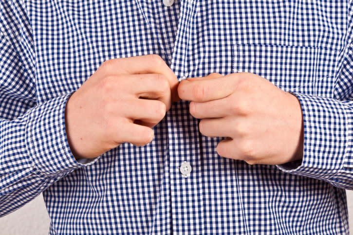 12. Unbutton your buttons Whether it’s an Oxford or a pair of chinos, make sure buttons aren’t secured before beginning a load. Otherwise you risk prematurely weakening their threading as they’re tossed to and fro in the machine. Credit: Thinkstock 