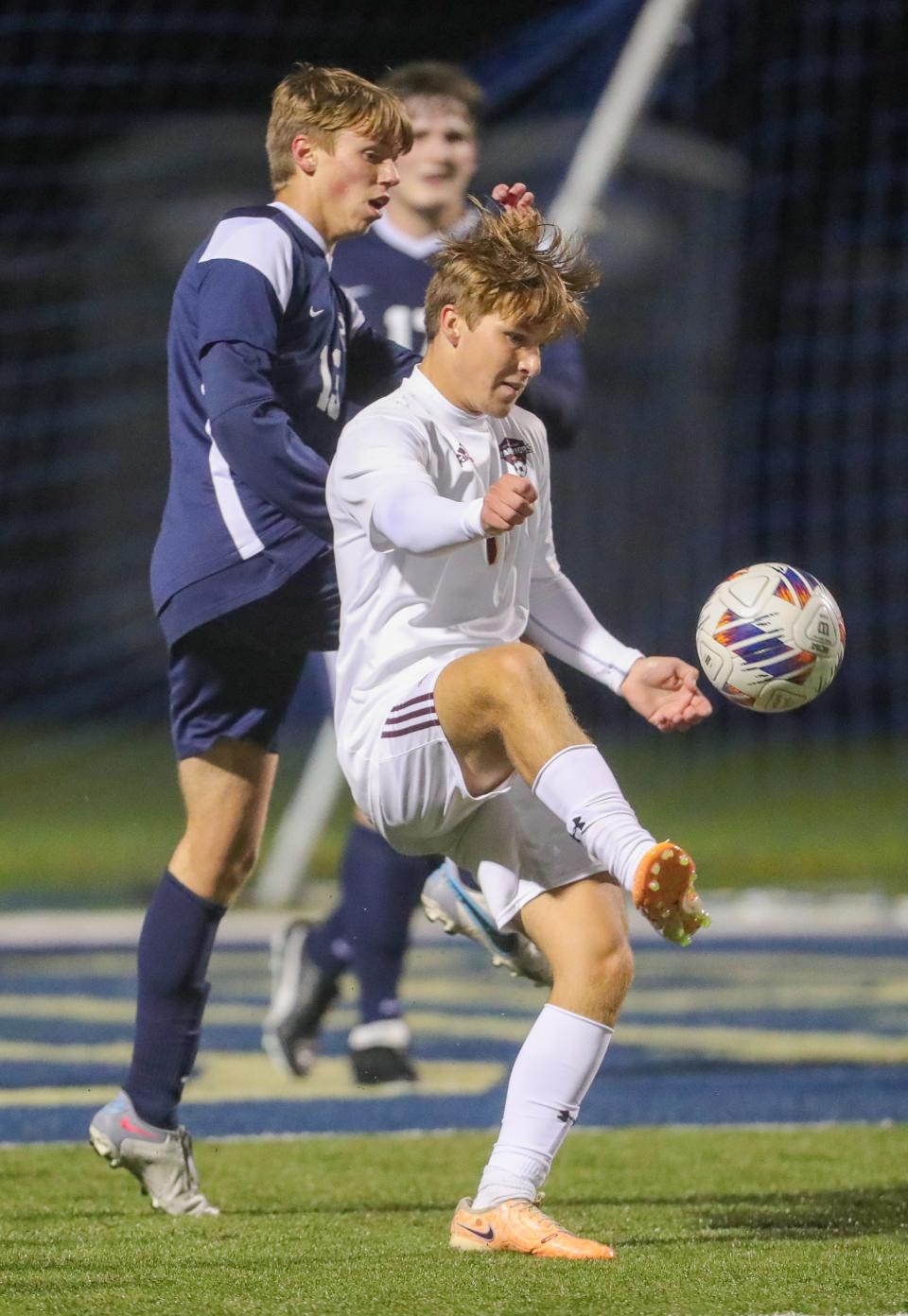 Walsh Jesuit's Carter Madden controls a pass in front of the net against Hoban on Oct. 14. Madden scored two goals to help the Warriors to a win over Aurora in a Division I district final Saturday in Barberton.