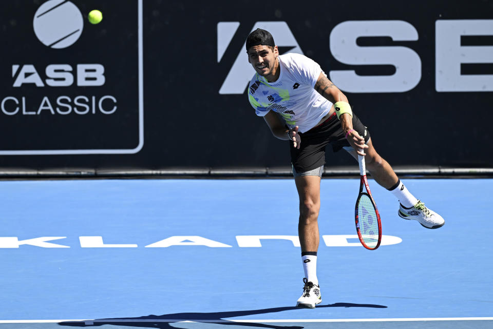 Alejandro Tabilo of Chile serves to Arthur Fils of France during their semifinal at the ASB Classic tennis tournament in Auckland, New Zealand. Friday Jan. 12, 2024. (Andrew Cornaga/Photosport via AP)