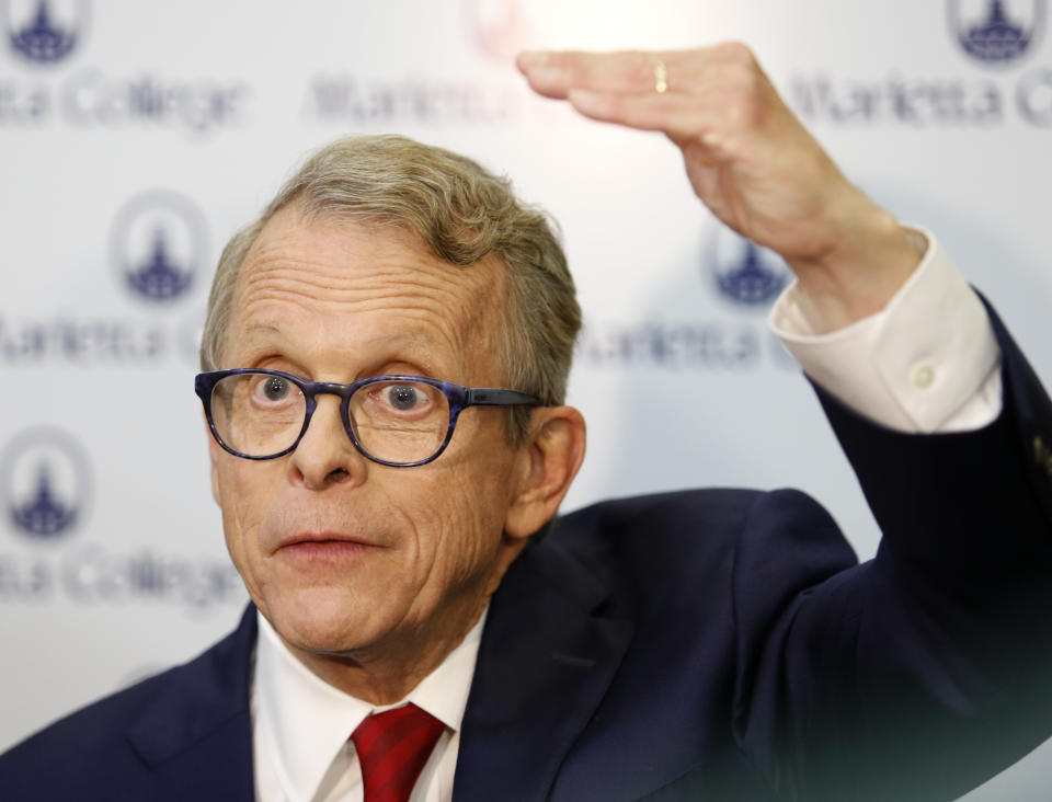 Ohio Attorney General and Republican gubernatorial candidate Mike DeWine answers reporters' questions in the spin room following a debate with Democratic gubernatorial candidate Richard Cordray at Marietta College in Marietta, Ohio, Monday, Oct. 1, 2018. (AP Photo/Paul Vernon)