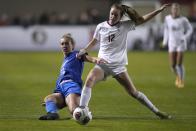 BYU's Olivia Wade (10) battles for the ball against Florida State's Heather Payne (12) during the first half in the NCAA College Cup women's soccer final Monday, Dec. 6, 2021, in Santa Clara, Calif. (AP Photo/Tony Avelar)