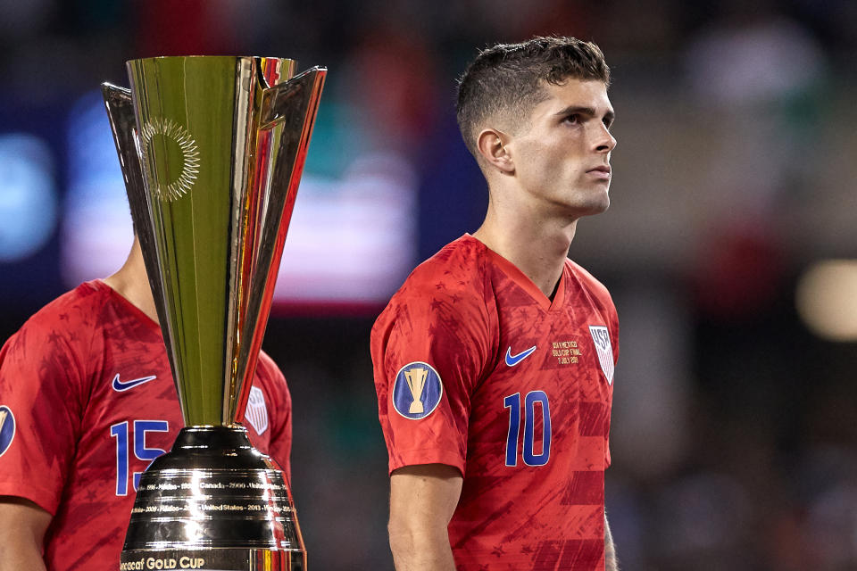 CHICAGO, IL - JULY 07: United States midfielder Christian Pulisic (10) walks past the 2019 Gold Cup Trophy after the CONCACAF Gold Cup final match between the United States and Mexico on July 07, 2019, at Soldier Field in Chicago, IL. (Photo by Robin Alam/Icon Sportswire via Getty Images)