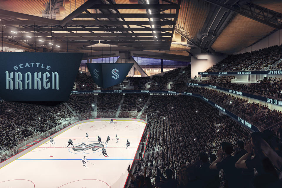 This artists rendering released Thursday, July 23, 2020, by the Seattle Kraken, shows the NHL hockey team's new logo, left, and name, displayed in what would be their finished arena. (Seattle Kraken via AP)