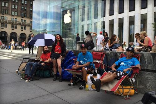 People in lawn chairs in line for the new iPhone