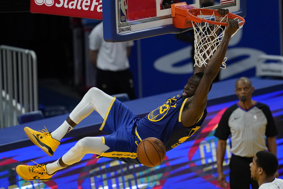 Golden State Warriors forward Draymond Green dunks against the Orlando Magic during the second half of an NBA basketball game in San Francisco, Thursday, Feb. 11, 2021. (AP Photo/Jeff Chiu)