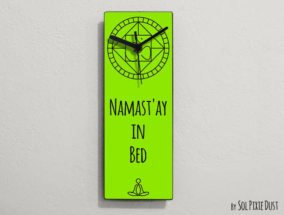 <i>Namast'ay In Bed Wall Clock, <a href="https://www.etsy.com/listing/229817093/namastay-in-bed-namaste-in-bed-namastay?ga_order=most_relevant&amp;ga_search_type=all&amp;ga_view_type=gallery&amp;ga_search_query=funny%20wall%20clock&amp;ref=sr_gallery_5" target="_blank">$14.90</a></i>