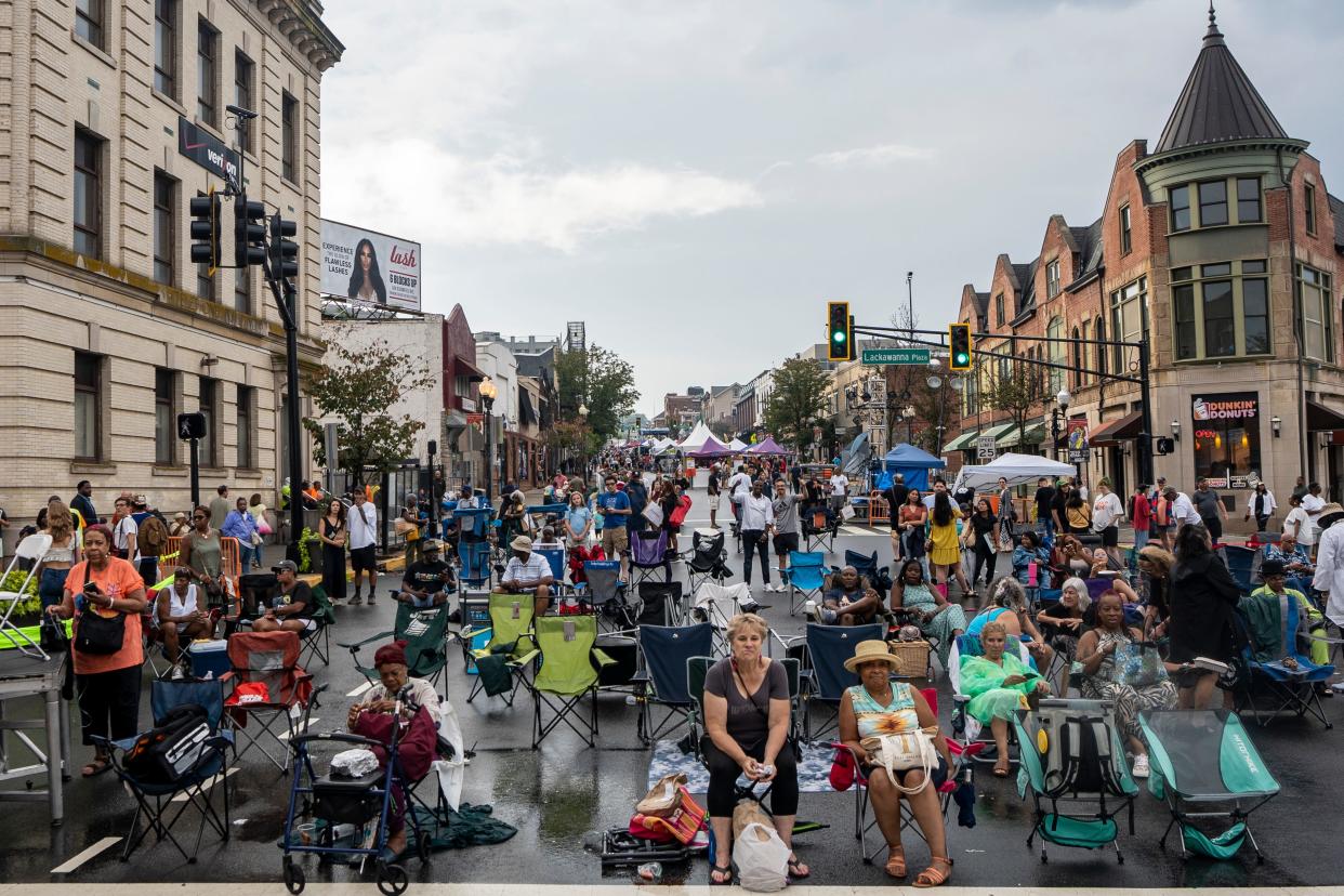 People sit in their lawn chairs waiting for the live music to resume after a rain delay at the Montclair Jazz Festival on Saturday, September 9, 2023.