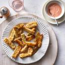 <p>These crunchy, crispy zucchini fries turn very tender in the air fryer and have a delicate natural sweetness from the cooking process. The simple dipping sauce is very tomato forward, with just enough acid from the vinegar and mayonnaise to add incredible tang. <a href="https://www.eatingwell.com/recipe/270401/air-fryer-zucchini-fries/" rel="nofollow noopener" target="_blank" data-ylk="slk:View Recipe" class="link ">View Recipe</a></p>