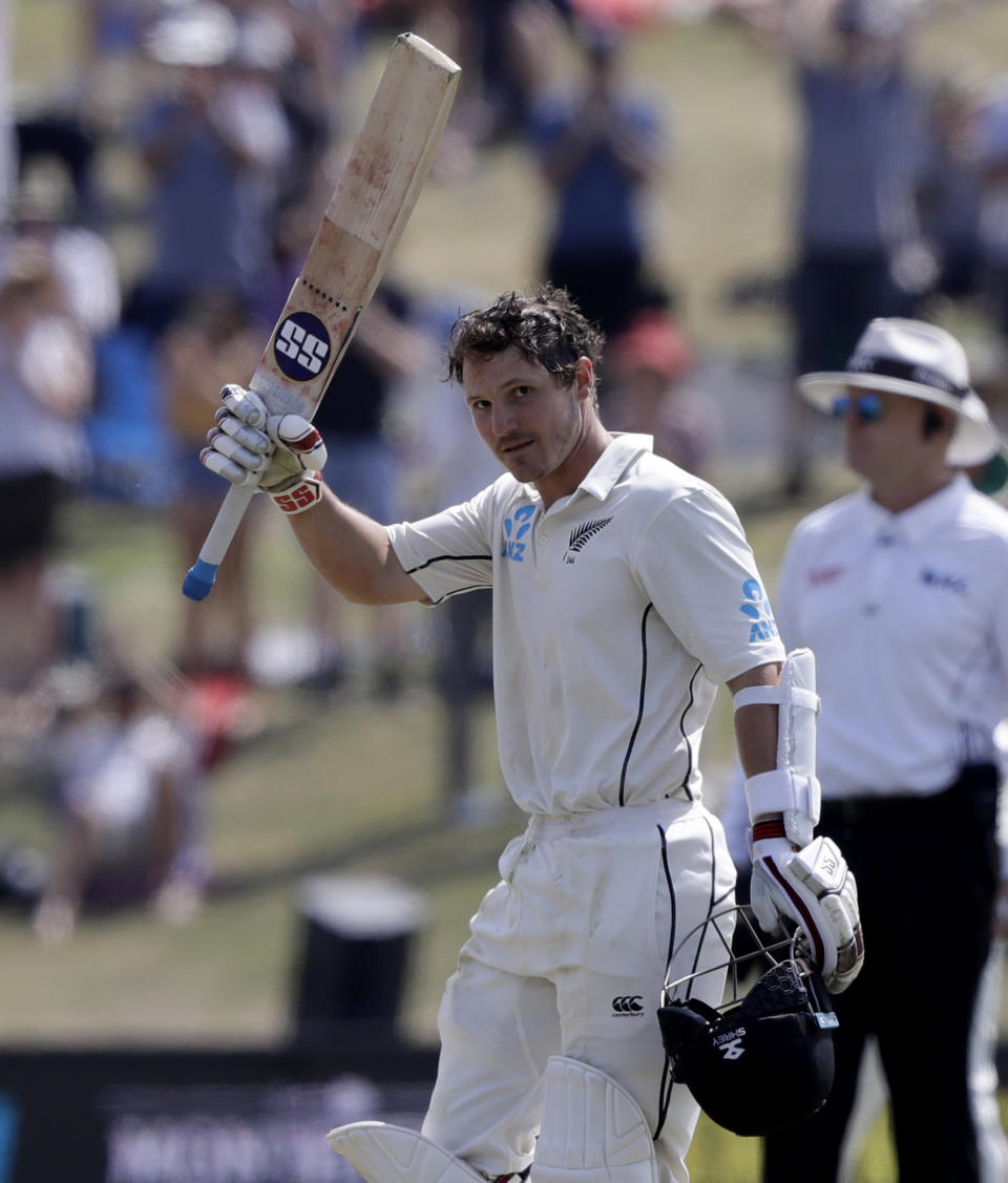 New Zealand's BJ Watling celebrates after reaching 200 runs during play on day four of the first cricket test between England and New Zealand at Bay Oval in Mount Maunganui, New Zealand, Sunday, Nov. 24, 2019. (AP Photo/Mark Baker)