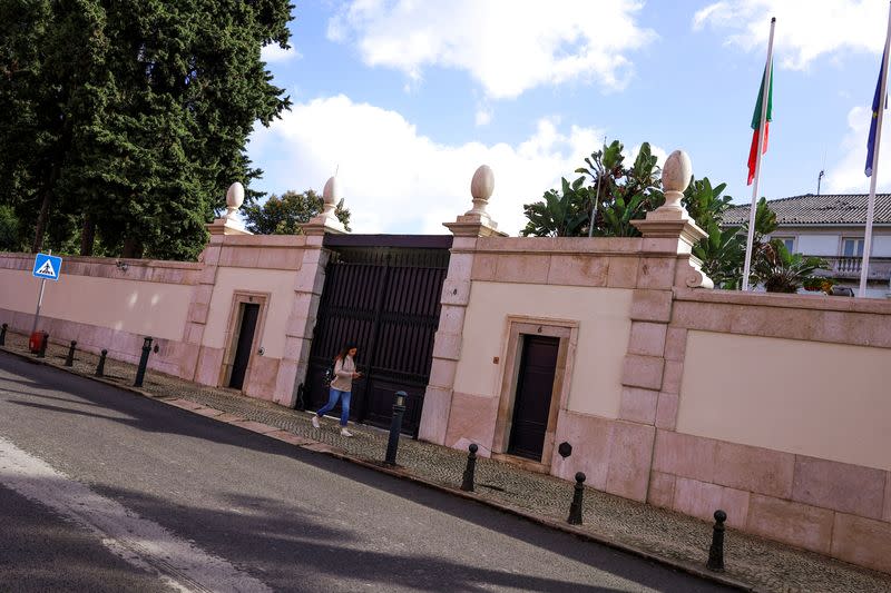 A woman passes the entrance of Portugal Prime Minister official redidence in Sao Bento Palace, Lisbon