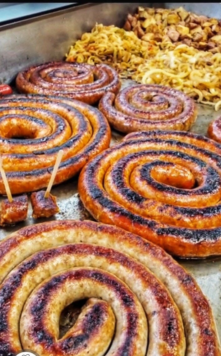 Sausages cook on a grill inside Rocco's Italian Sausages & Cheese Steaks, which opened its newest location in Souderton.