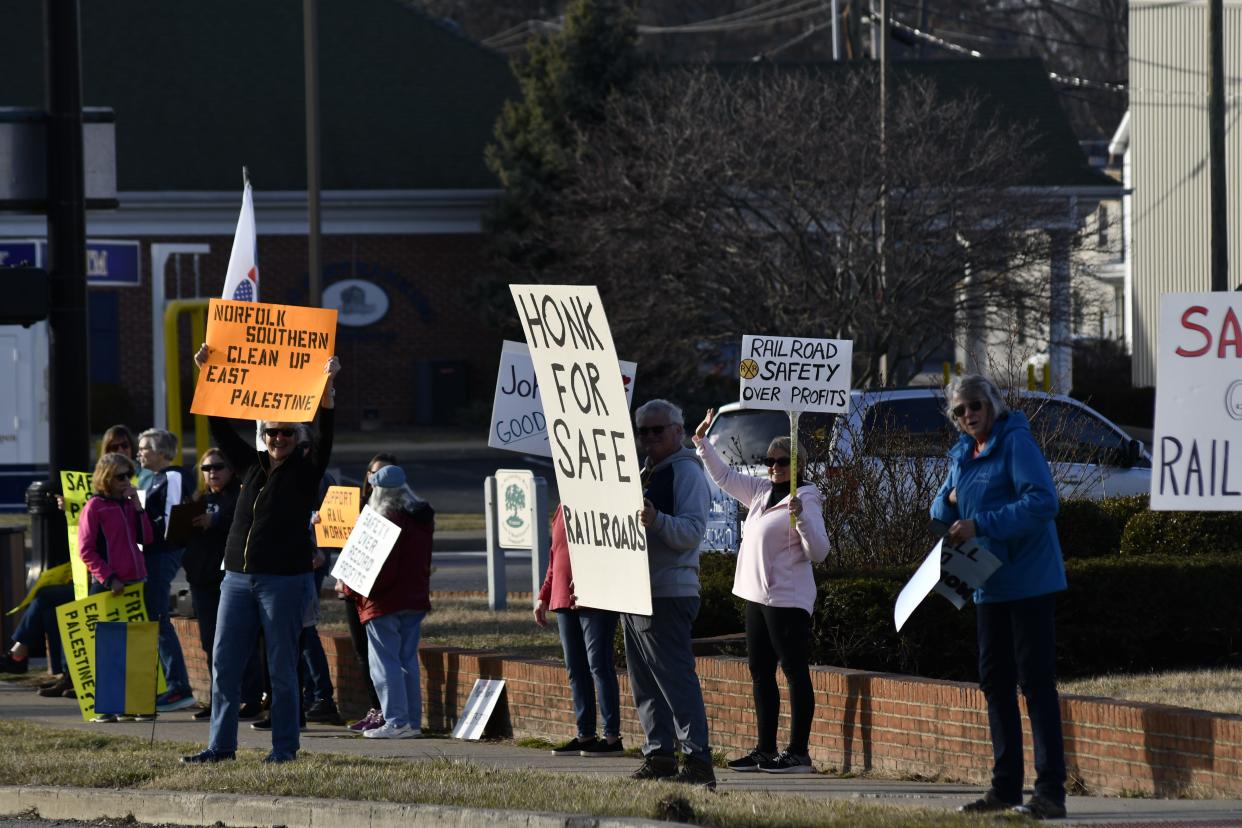 People for Peace and Justice Sandusky County take to the streets in Downtown Fremont Wednesday afternoon to call for improved railway safety following last month's train derailment when hazardous chemicals contaminated soil, air and water in East Palestine.