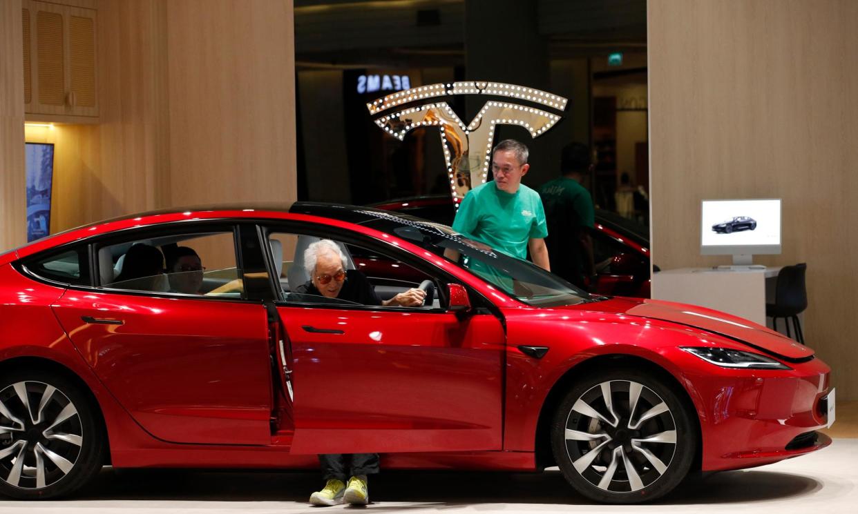 <span>The Tesla Model 3 is one of the most popular models of EV available in Australia. EVs are ‘a core part of everyday Australian lives,’ the Electric Vehicle Council says.</span><span>Photograph: Rungroj Yongrit/EPA</span>