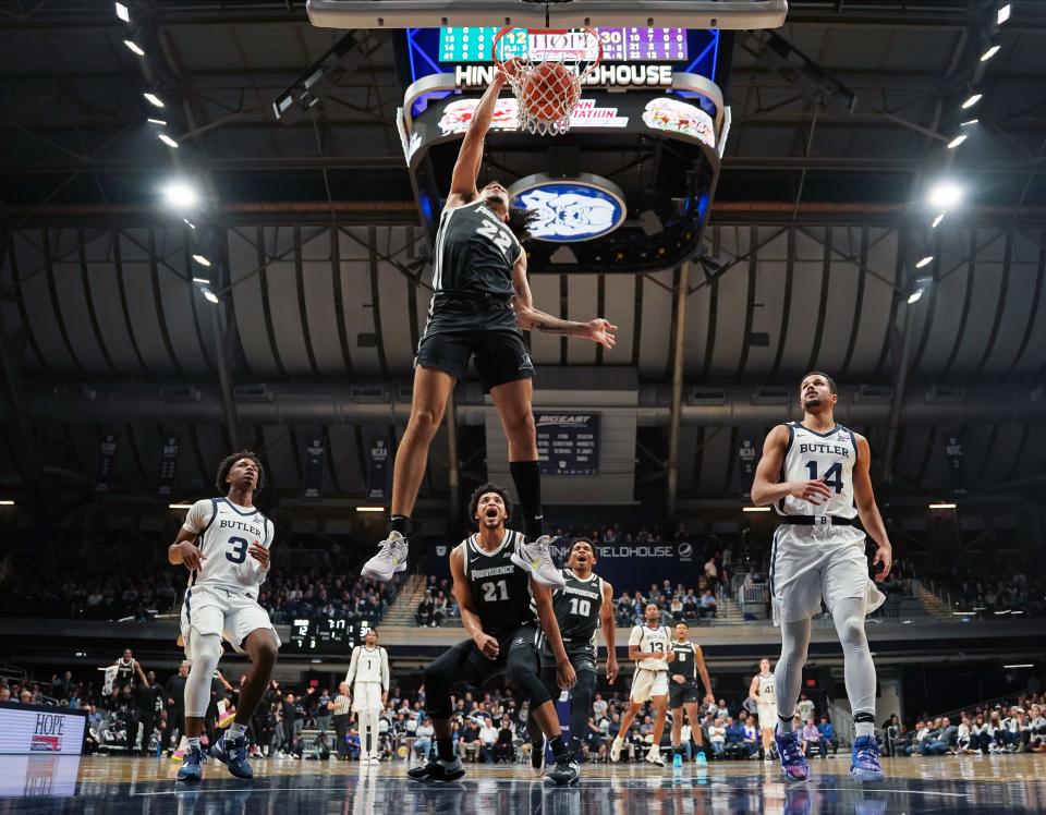 PC guard Devin Carter dunks the ball for two of his game-high 21 points against Butler during the first half Thursday night at Hinkle Fieldhouse in Indianapolis.