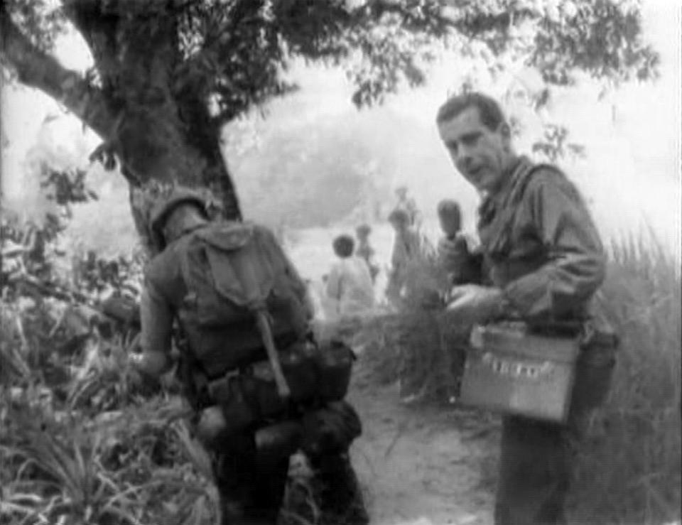 American newsman Morley Safer, correspondent for CBS News, as Safer reports on the systematic burning of South Vietnamese villages by U.S. Marines during the Vietnam War, in Cam Ne, in 1965. The broadcast showed Marines igniting huts with Zippo lighters. 