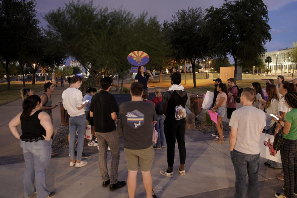 FILE - Protesters gather outside the Capitol to voice their dissent with an abortion ruling, Friday, Sept. 23, 2022, in Phoenix. An Arizona judge ruled the state can enforce a near-total ban on abortions that has been blocked for nearly 50 years. The law was first enacted decades before Arizona became a state in 1912. (AP Photo/Matt York, File)