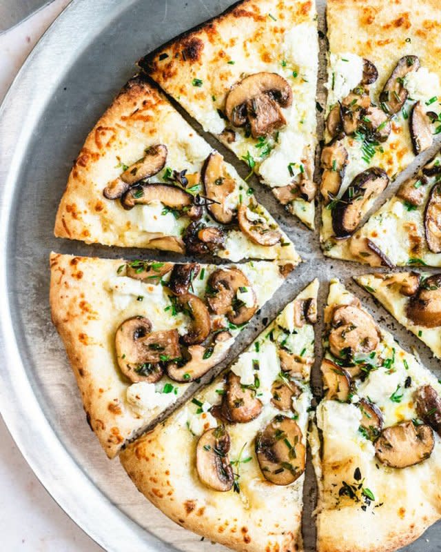 <p>A Couple Cooks</p><p>This mushroom pizza is a white pizza that’s covered with mozzarella cheese, goat cheese and fresh herbs. It’s perfection!</p><p><strong>Get the recipe: <a href="https://www.acouplecooks.com/mushroom-pizza-with-fresh-herbs/" rel="nofollow noopener" target="_blank" data-ylk="slk:Mushroom Pizza with Fresh Herbs;elm:context_link;itc:0;sec:content-canvas" class="link rapid-noclick-resp">Mushroom Pizza with Fresh Herbs</a></strong></p>