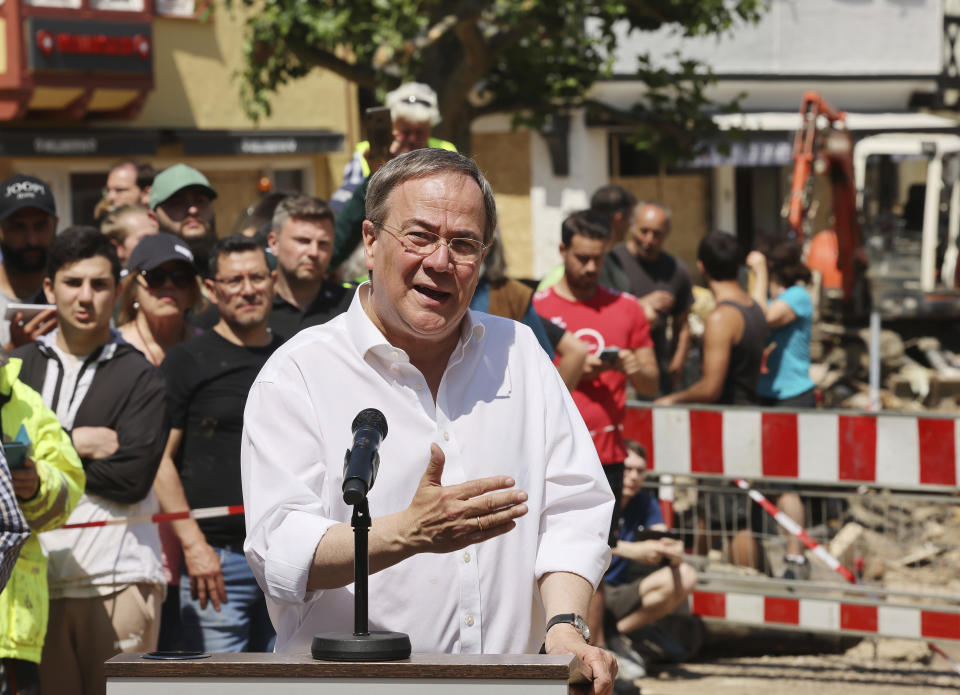 Armin Laschet (CDU), Minister President of North Rhine-Westphalia, gives a press conference in Bad Muenstereifel, Germany, Tuesday, July 20, 2021. Laschet and Chancellor Merkel have visited Bad Muenstereifel, which was badly affected by the storm. (Oliver Berg/DPA via AP, Pool)