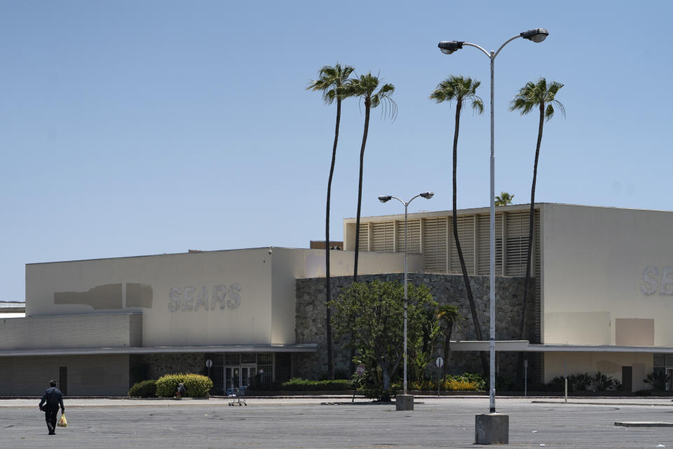 This Thursday, May 27, 2021, photo shows the closed Sears in Buena Park Mall in Buena Park, Calif. California state lawmakers are grappling with a particularly 21st-century problem: What to do with the growing number of shopping malls and big-box retail stores left empty by consumers shifting their purchases to the web. A possible answer in crowded California cities is to build housing on these sites, which already have ample parking and are close to existing neighborhoods. (AP Photo/Damian Dovarganes)