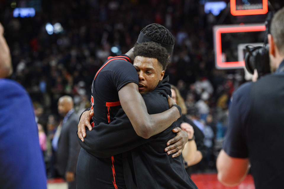 Miami Heat guard Kyle Lowry, right, hugs Toronto Raptors forward Chris Boucher after an NBA basketball game Tuesday, March 28, 2023, in Toronto. (Christopher Katsarov/The Canadian Press via AP)